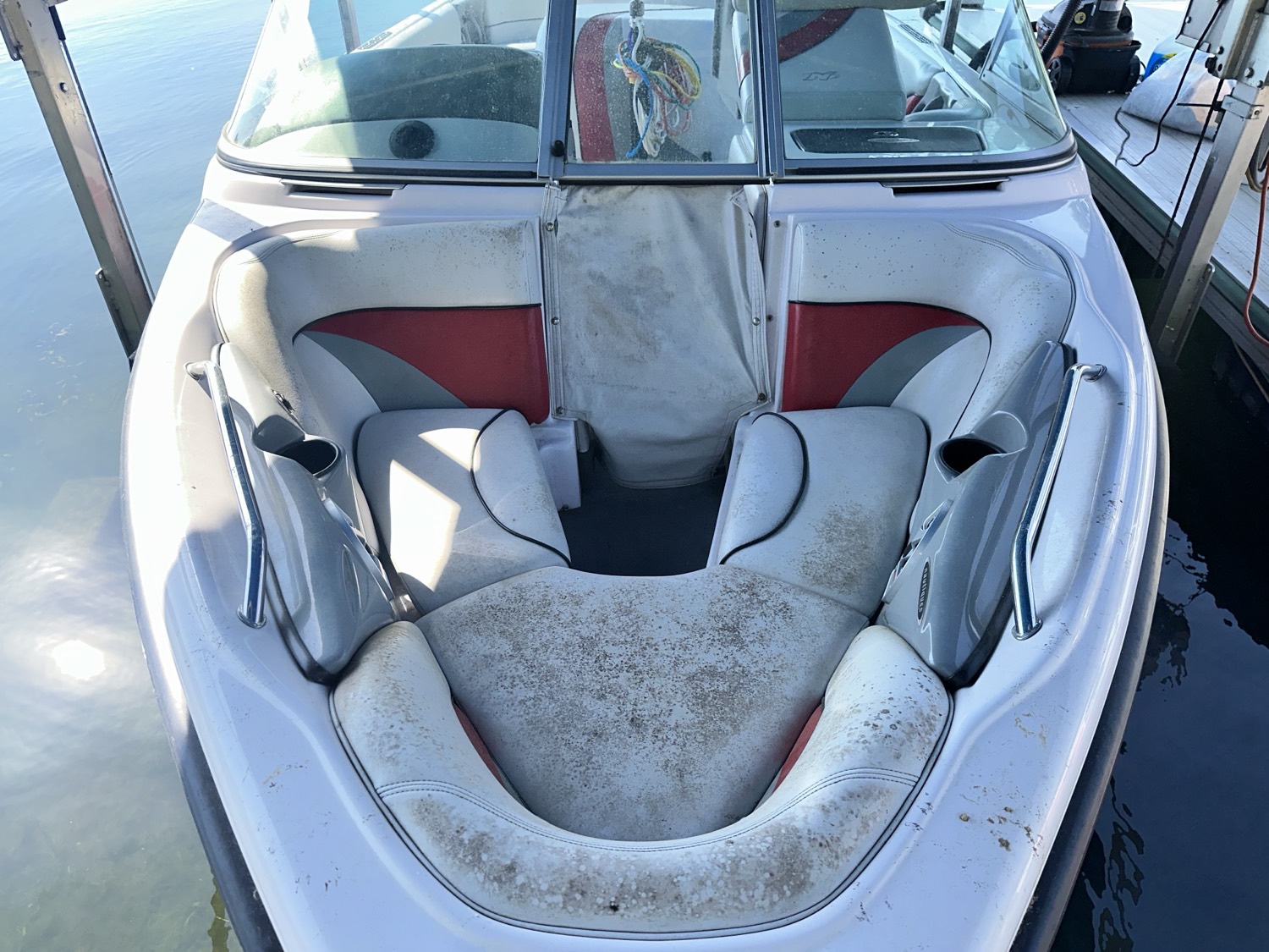 Boat bow seats before detailing, with mildew and dirt staining